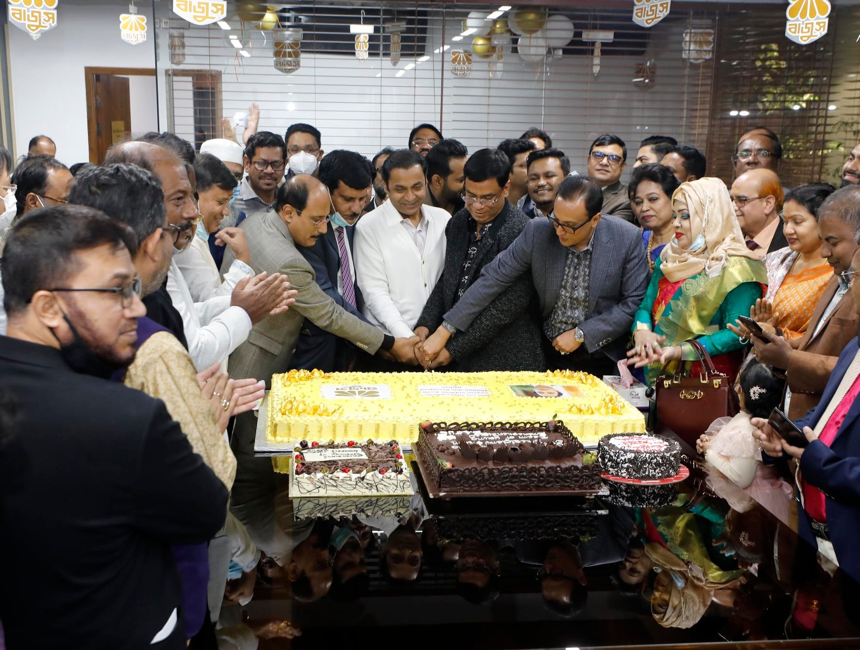 Bangladesh Jeweller's Association (BAJUS) celebrates its President Sayem Sobhan Anvir's birthday by cutting cakes on Tuesday at its new office in Bashundhara Shopping Complex.